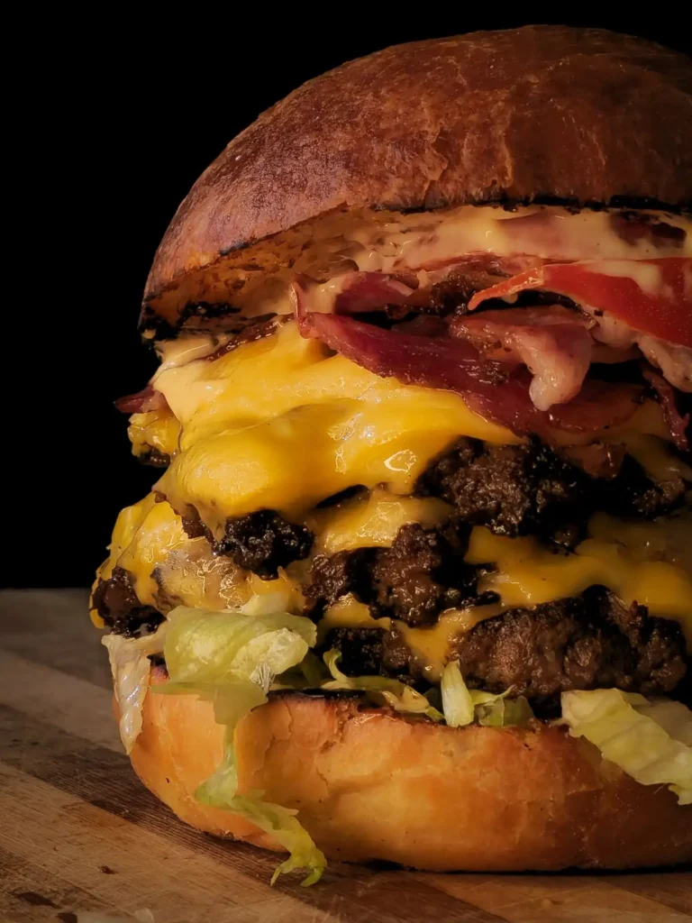 Double bacon cheeseburger with melted cheese and lettuce