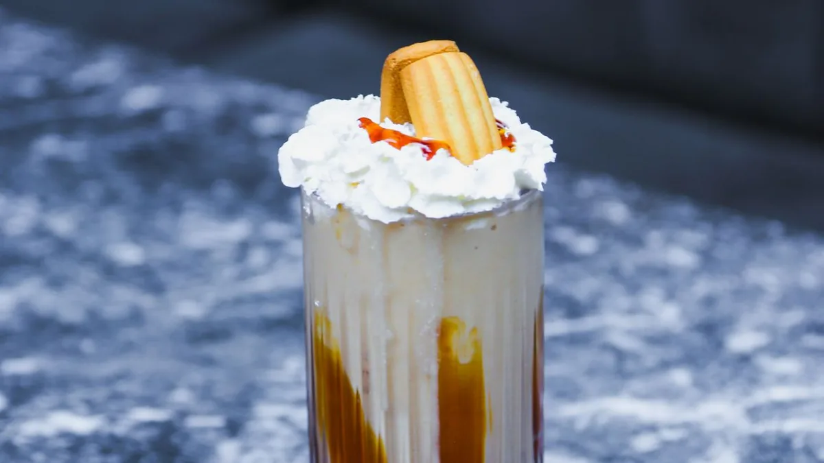 Caramel milkshake drizzled with caramel sauce
