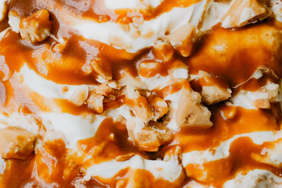 Golden toffee pieces folded into vanilla ice cream